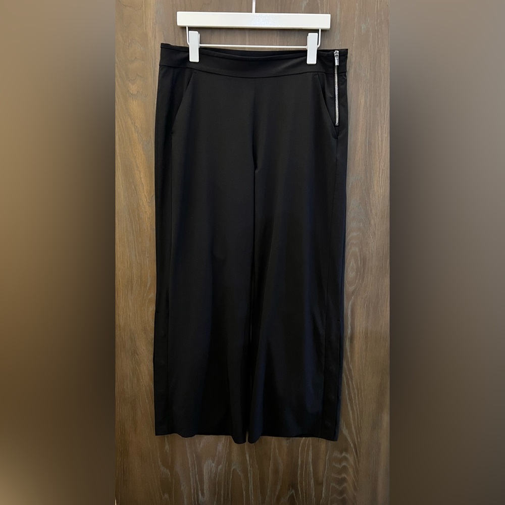 ATHLETA long black pant. Side zipper with button detail at the bottom of…